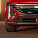 Front view of the 2024 Cadillac LYRIQ Sport trim with front grille illuminated.