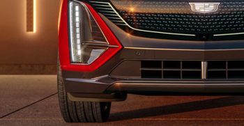 Front view of the 2024 Cadillac LYRIQ Sport trim with front grille illuminated.