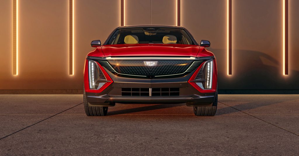 Front view of the 2024 Cadillac LYRIQ Sport trim with front grille illuminated.