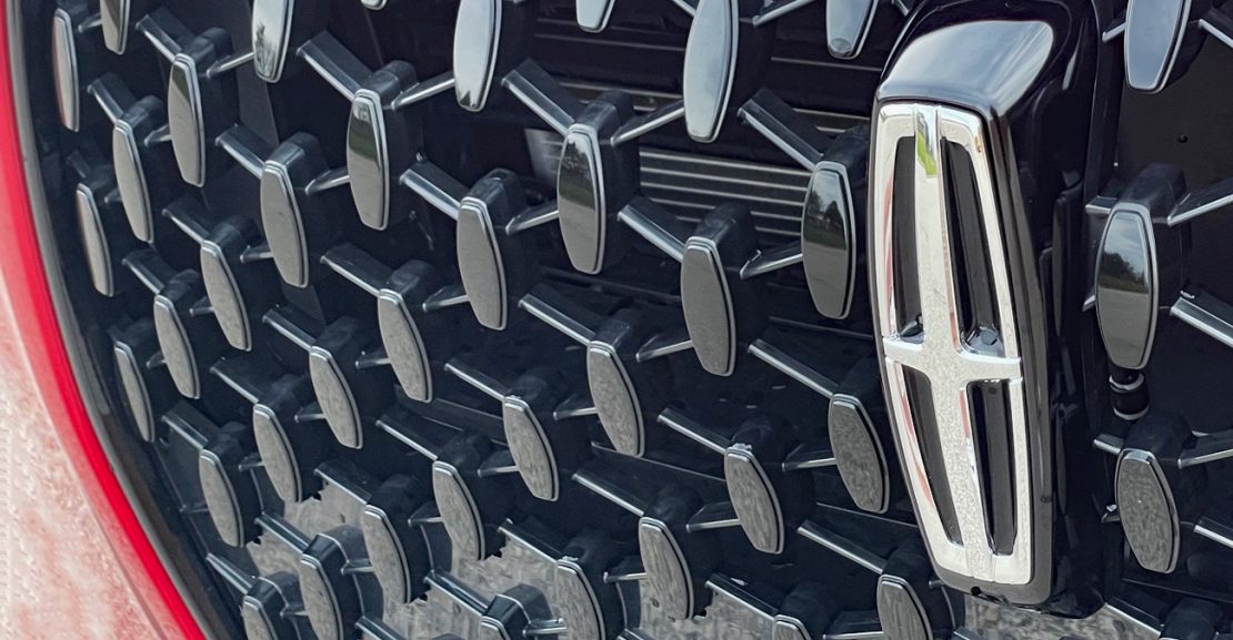2025 Lincoln Corsair Grand Touring in Red Carpet Metallic with Jet Package, grille detail