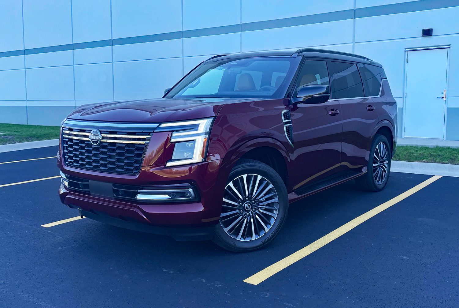 Nissan Armada Platinum Reserve in Coulis Red, Front 3/4 view