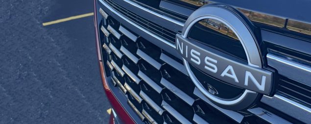 2025 Nissan Armada Platinum Reserve in Coulis Red, grille detail