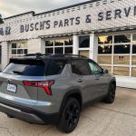 2025 Chevrolet Equinox Midnight Edition, Rear 3/4 view, vintage filling station, village goodyear store,
