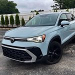 2025 Volkswagen Taos SEL, front 3/4 view,