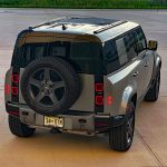 2025 Land Rover Defender 110 X-Dynamic SE in Silicon Silver, rear 3/4 view