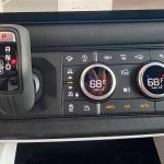 2025 Land Rover Defender 110 X-Dynamic SE in Silicon Silver, shifter and climate controls, gear selector,