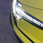 2025 Volvo EX30 in Moss Yellow, headlight detail,