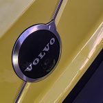 2025 Volvo EX30 in Moss Yellow, Volvo logo on grille,