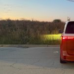 2025 Volkswagen ID. Buzz, Energetic Orange, rear view, sunset, headlights on,