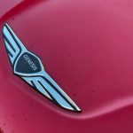2026 Genesis GV70 Sport Prestige in Mauna Red, hood, hood badge,