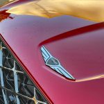2026 Genesis GV70 Sport Prestige in Mauna Red, grille detail,