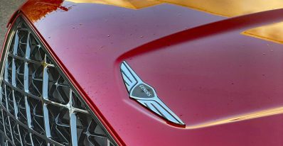 2026 Genesis GV70 Sport Prestige in Mauna Red, grille detail,