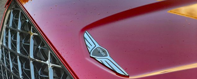2026 Genesis GV70 Sport Prestige in Mauna Red, grille detail,