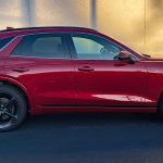 2026 Genesis GV70 Sport Prestige in Mauna Red, profile, sunset, magic hour,