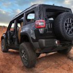 The all-new, all-electric, Trail Rated 2026 Jeep® Recon. rear 3/4 view, doors off