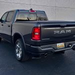 2026 Ram 1500 Big Horn in Granite Crystal, tailgate, rear 3/4 view,