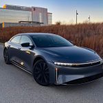 2026 Lucid Air Touring in Fathom Blue, front 3/4 view, sunset, golden hour,