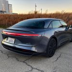 2026 Lucid Air Touring in Fathom Blue, rear 3/4 view, sunset,