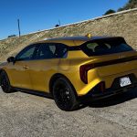 2026 Kia K4 Hatchback in Sparkling Yellow, rear 3/4 view, rear angle,