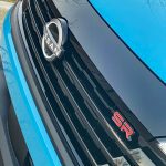 2026 Nissan Kicks SR in Arctic Ice Blue, grille detail,