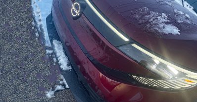 2026 Nissan Leaf Platinum+ in Coulis Red Pearl, front clip, grille detail,