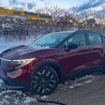 2026 Nissan Leaf Platinum+ in Coulis Red Pearl, front 3/4 view,