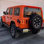 2025 Jeep Wrangler Sahara in Joose, rear 3/4 view, hard top,