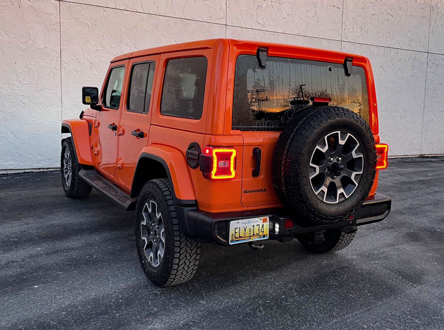 2025 Jeep Wrangler Sahara in Joose, rear 3/4 view, hard top,