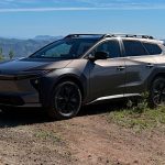 2026 Toyota bZ Woodland with all-terrain tires, sunny day, front 3/4 view,