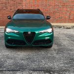 2025 Alfa Romeo Stelvio Intensa in Verde Fangio, front end, grille, lights on