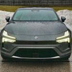 2026 Polestar 4 in Stratus, front end, lights on,