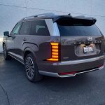 2026 Hyundai Palisade Hybrid in Cast Iron Brown, rear 3/4 view