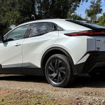 2026 Toyota C-HR SE, White, rear 3/4 view, black wheels,