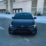 2026 Toyota Corolla Hybrid SE, front view, headlights on,