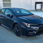 2026 Toyota Corolla Hybrid SE in Underground, front 3/4 view, sunset, dusk,