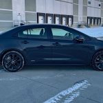 2026 Toyota Corolla Hybrid SE in Underground, profile view, sunset,