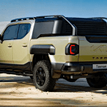 2026 Kia Tasman, rear 3/4 view, black wheels,