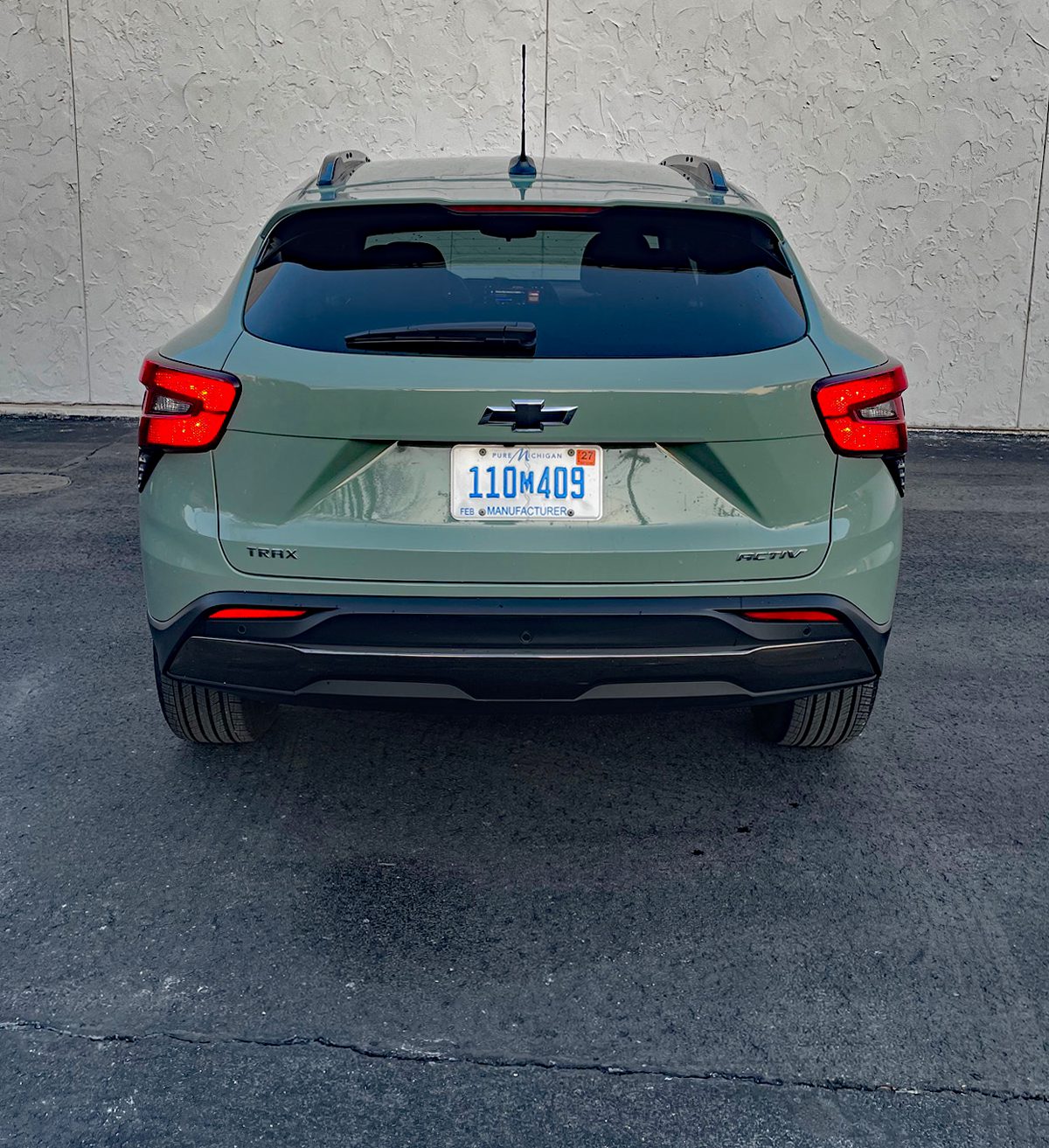 2026 Chevrolet Trax ACTIV in Cacti Green, rear view, taillights on,