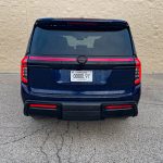 2026 Nissan Armada PRO-4X in Deep Ocean Blue Pearl, rear view, taillights on,