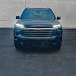 2026 Chevrolet Traverse High Country in Lakeshore Blue, front view, headlights on