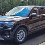 2026 Ford Explorer Active in Agate Black Metallic, front 3/4 view, Active 100A, Rental