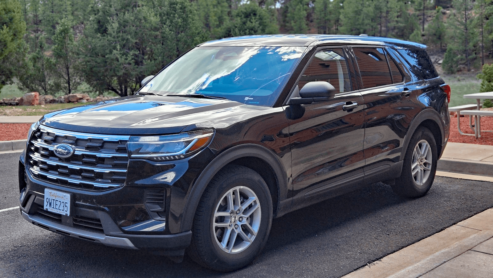 2026 Ford Explorer Active in Agate Black Metallic, front 3/4 view, Active 100A, Rental