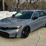 2026 Honda Civic Si, front 3/4 view, black wheels,