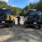 2026 Land Rover Defender Trophy Editions, yellow and blue, rear view,