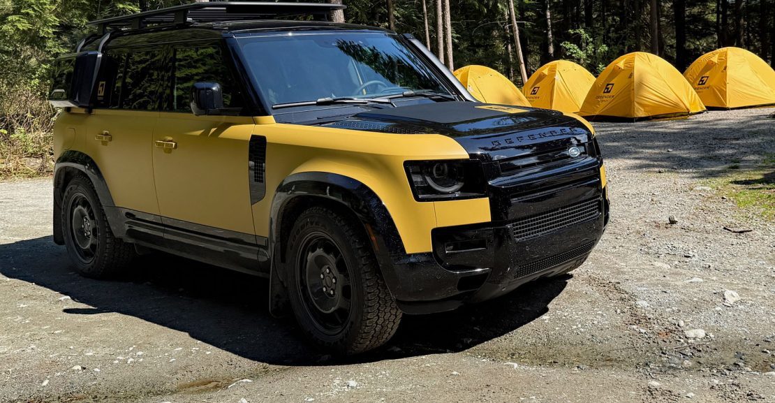 2026 Land Rover Defender Trophy Edition, yellow and black, front 3/4 view