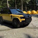 2026 Land Rover Defender Trophy Edition, yellow and black, front 3/4 view