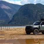 2026 Land Rover Defender Trophy Edition, blue, at speed,