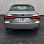 2025 Lexus LS 500 in Silver Illusion, rear view, taillights on,