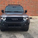 2026 Toyota Land Cruiser 1958 in Meteor Shower, front view, grille, round headlights,