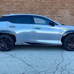 2026 Lexus RZ 500e F Sport in Wind, profile, brick wall, blue car,